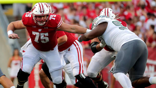 Wisconsin offensive lineman Joe Tippmann blocking against Eastern Michigan in 2021.
